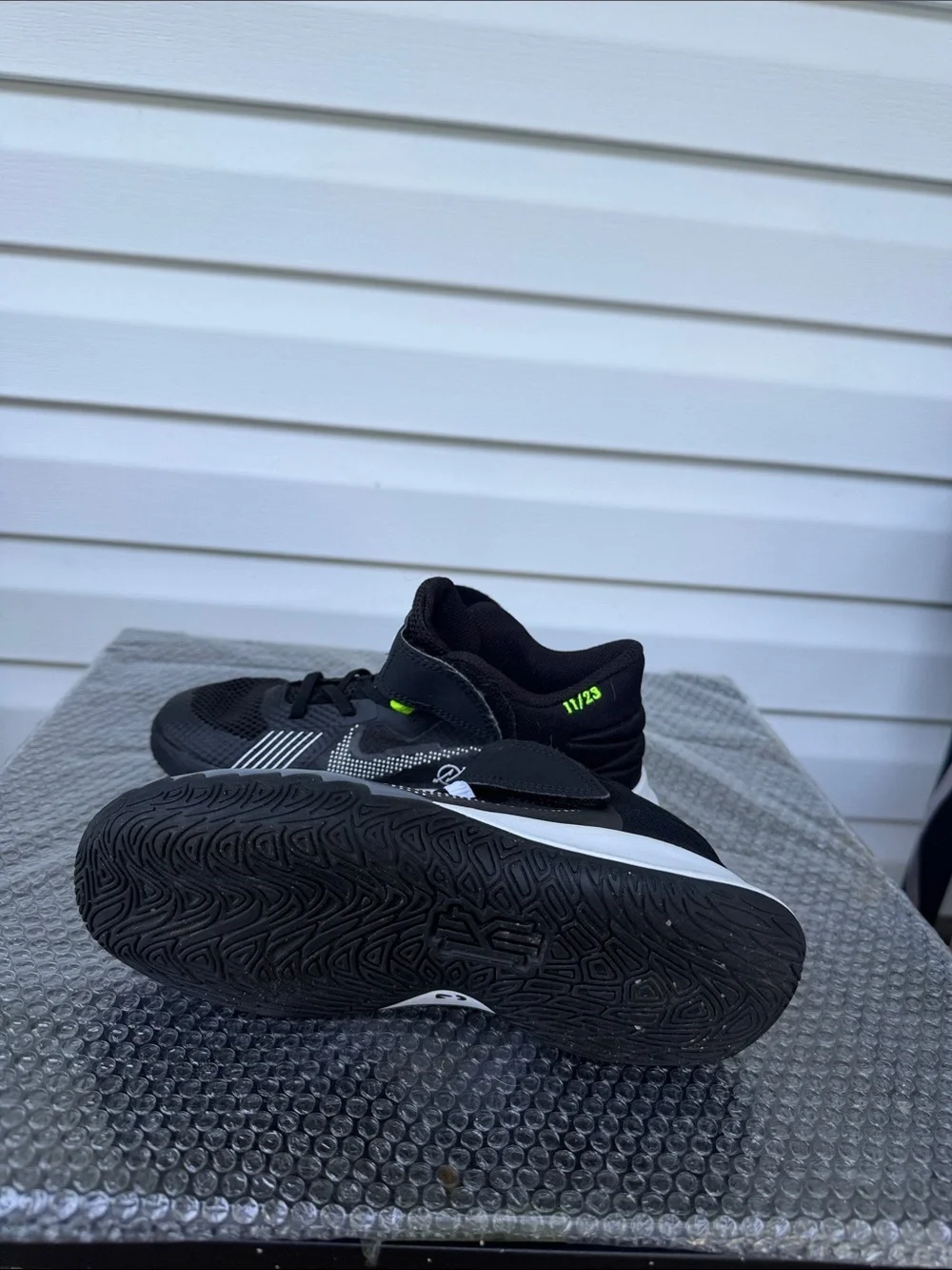 Nike Kids Black and White High-Top Sneakers with Neon Accent